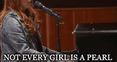A Woman Singing Into A Microphone With The Words Not Every Girl Is A Pearl Behind Her GIF