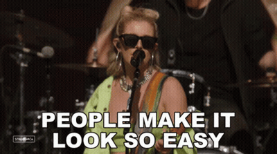 A Woman Singing Into A Microphone With The Words People Make It Look So Easy On The Bottom GIF