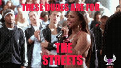A Woman Singing Into A Microphone With The Words These Dudes Are For The Streets Below Her GIF