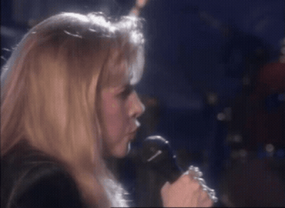 A Woman Singing Into A Microphone With The Words Was I Such A Fool GIF