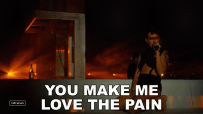 A Woman Singing Into A Microphone With The Words " You Make Me Love The Pain " GIF
