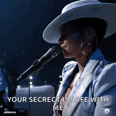 A Woman Singing Into A Microphone With The Words Your Secret Is Safe With Me Below Her GIF