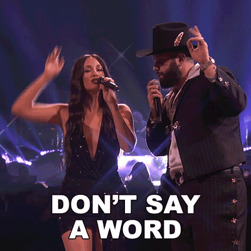 A Woman Singing Next To A Man With The Words " Don T Say A Word " GIF