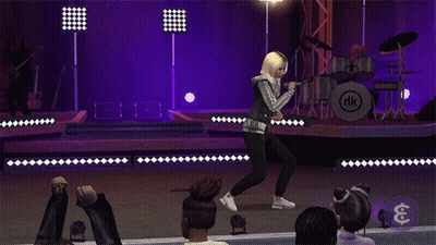 A Woman Singing On Stage In Front Of A Drum Set With Nk On It GIF