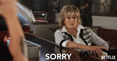 A Woman Sits At A Bar With A Netflix Logo On The Bottom Right GIF