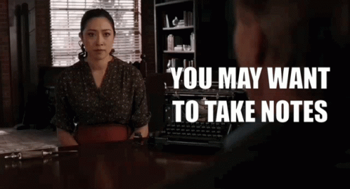 A Woman Sits At A Desk Talking To A Man With The Words " You May Want To Take Notes " Above Her GIF