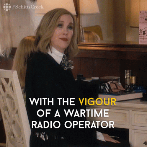 A Woman Sits At A Desk With The Words " With The Vigour Of A Wartime Radio Operator " GIF