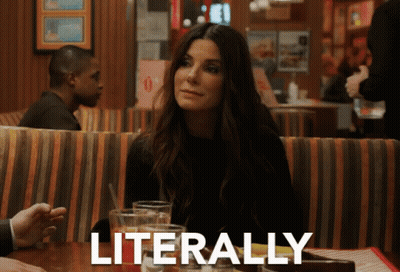 A Woman Sits At A Table In A Restaurant With Literally Written On The Bottom GIF