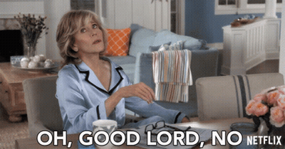 A Woman Sits At A Table With The Words Oh Good Lord No Netflix Written Below Her GIF