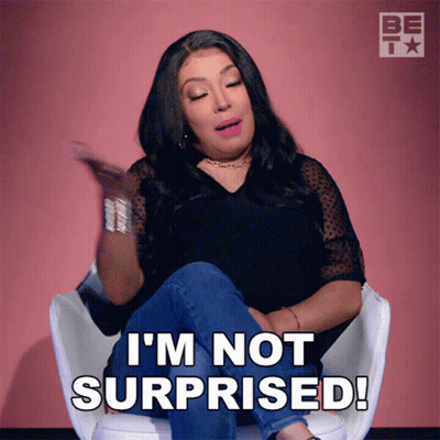 A Woman Sits In A Chair And Says " I 'M Not Surprised " GIF