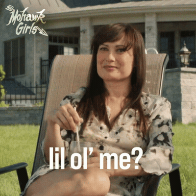 A Woman Sits In A Chair With A Glass In Her Hand And The Words Lil Ol ' Me Written On The Bottom GIF