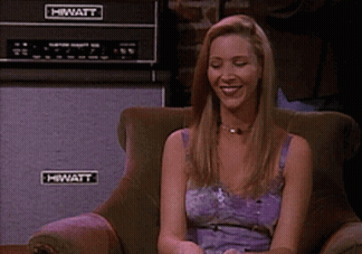 A Woman Sits In A Chair With A Hiwatt Amplifier In The Background GIF