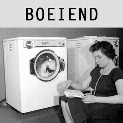 A Woman Sits In Front Of A Washing Machine With The Word Boeiend Above Her GIF