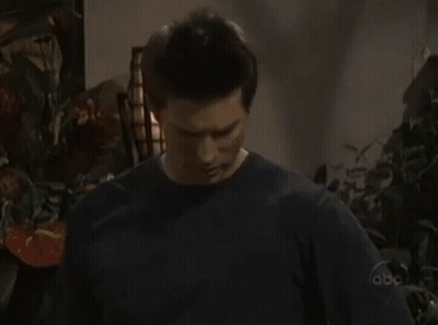 A Woman Sits On A Couch Talking On A Cell Phone With The Abc Logo Visible GIF