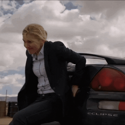 A Woman Sits On The Back Of An Eclipse GIF
