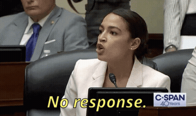 A Woman Sitting At A Desk With A Sign That Says C-Span 40 Years GIF