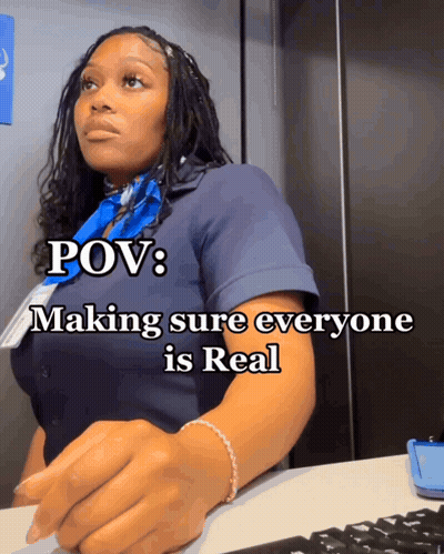 A Woman Sitting At A Desk With The Words Pov Making Sure Everyone Is Real On The Bottom GIF