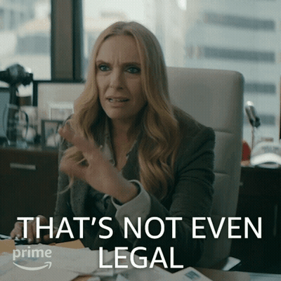 A Woman Sitting At A Desk With The Words That 'S Not Even Legal Written On The Bottom GIF