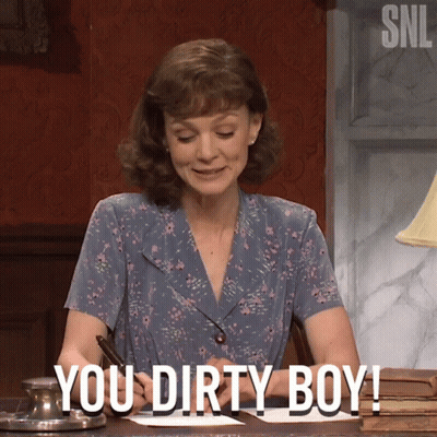 A Woman Sitting At A Desk With The Words " You Dirty Boy " Written On Her Face GIF