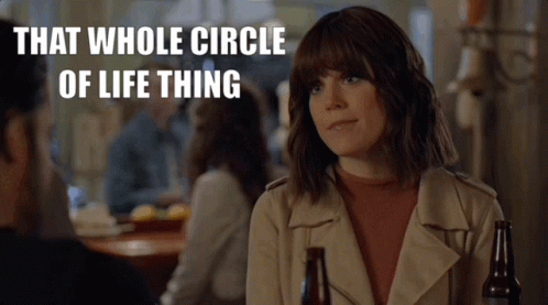 A Woman Sitting At A Table With A Bottle Of Beer And The Words That Whole Circle Of Life Thing GIF