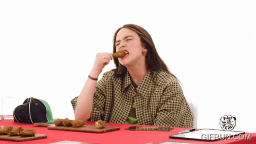 A Woman Sitting At A Table With A Clipboard That Says Gifrun.com On The Bottom GIF