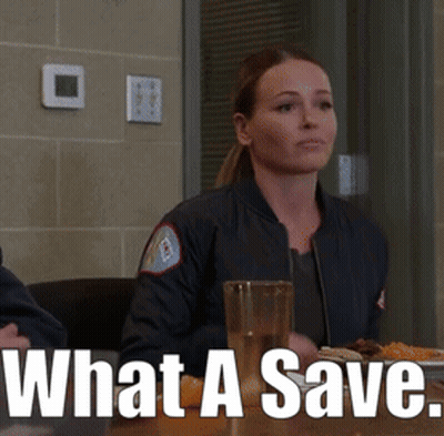 A Woman Sitting At A Table With A Glass Of Water And The Words What A Save On The Bottom GIF