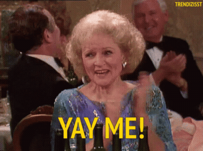 A Woman Sitting At A Table With A Glass Of Wine And The Words Yay Me GIF