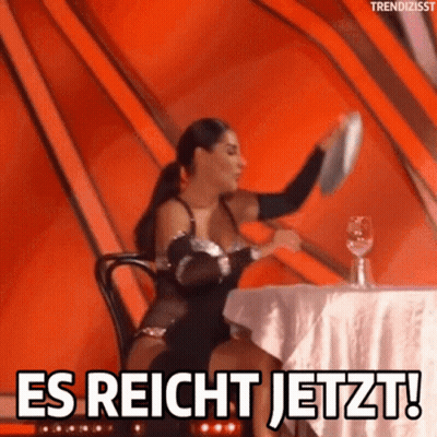 A Woman Sitting At A Table With A Plate In Her Hand And The Words Es Reicht Jetzt GIF