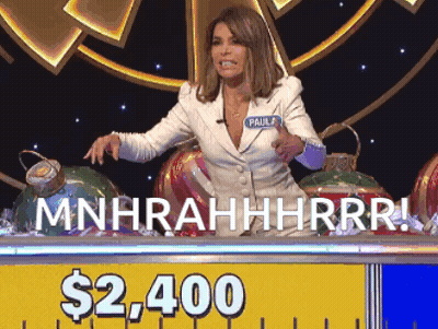 A Woman Sitting At A Table With A Sign That Says $ 2,400 On It GIF