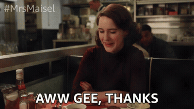 A Woman Sitting At A Table With The Words Aww Gee Thanks Written On The Screen GIF
