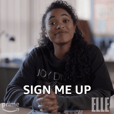 A Woman Sitting At A Table With The Words Sign Me Up Written On Her Face GIF