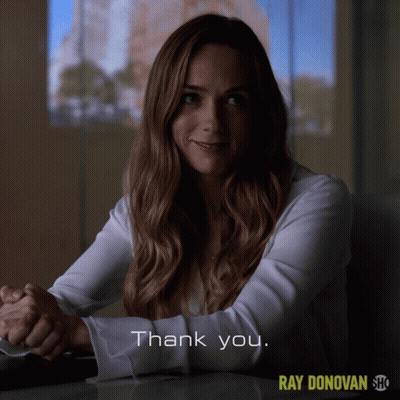 A Woman Sitting At A Table With The Words Thank You On The Bottom Right GIF