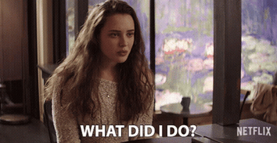 A Woman Sitting At A Table With The Words What Did I Do Written On The Bottom GIF