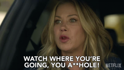 A Woman Sitting In A Car Says " Watch Where You 'Re Going You A Hole " GIF