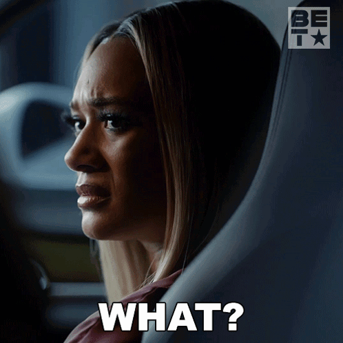 A Woman Sitting In A Car With A Question Mark That Says What GIF