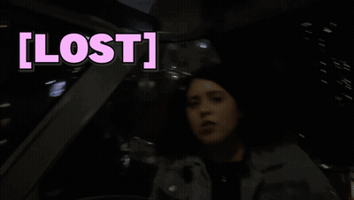 A Woman Sitting In A Car With The Word Lost Written Above Her GIF