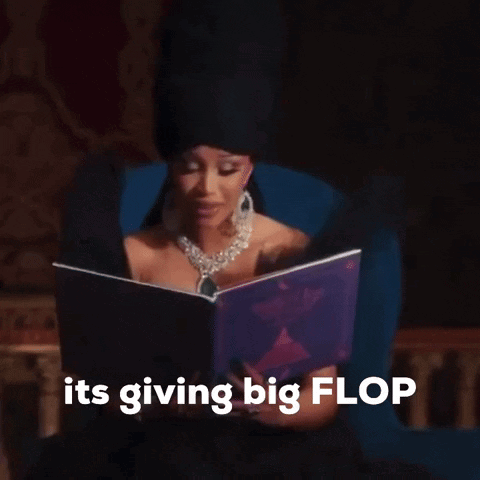 A Woman Sitting In A Chair Reading A Book With The Words " Its Giving Big Flop " Above Her GIF