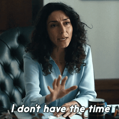 A Woman Sitting In A Chair Says " I Don 'T Have The Time " GIF