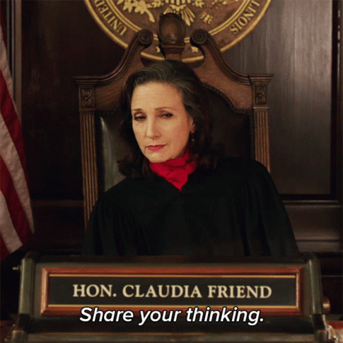 A Woman Sitting In A Chair With A Name Plate That Says Hon Claudia Friend Share Your Thinking GIF