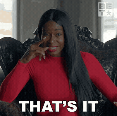 A Woman Sitting In A Chair With Her Finger On Her Nose And The Words That 'S It GIF