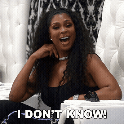 A Woman Sitting In A Chair With The Words " I Don 'T Know " On The Bottom GIF