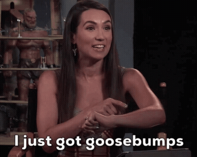 A Woman Sitting In A Chair With The Words I Just Got Goosebumps On The Screen GIF