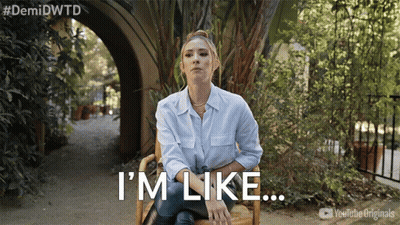 A Woman Sitting In A Chair With The Words I 'M Like Written Below Her GIF