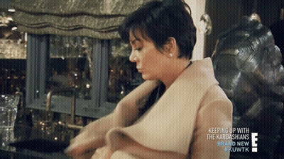 A Woman Sitting In A Chair With The Words Keeping Up With The Kardashians Brand New GIF