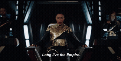 A Woman Sitting In A Chair With The Words Long Live The Empire On The Bottom GIF