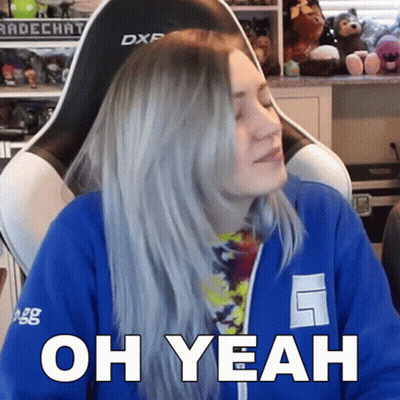 A Woman Sitting In A Chair With The Words Oh Yeah On Her Face GIF