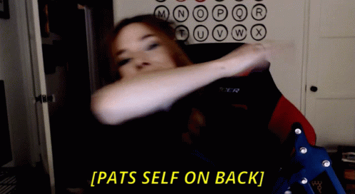 A Woman Sitting In A Chair With The Words Pats Self On Back Behind Her GIF