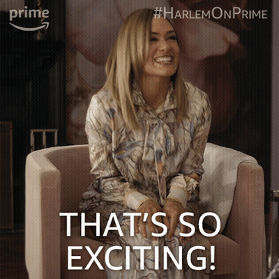 A Woman Sitting In A Chair With The Words " That 'S So Exciting " On The Bottom GIF