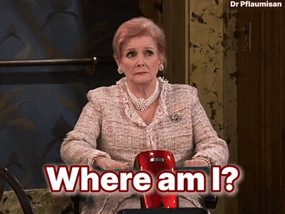 A Woman Sitting In A Chair With The Words Where Am I Written Above Her GIF