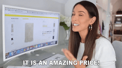 A Woman Sitting In Front Of A Computer With The Words " It Is An Amazing Price " GIF
